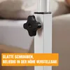 Close-up of a white adjustable table leg with a black knob, with a bed in the background. Voir les images du produit