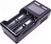 A black battery charger with two slots and a digital display. Anteprima dell’immagine prodotto