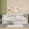 A daybed with multiple pillows and blankets is set up in a room with artwork on the wall. Náhľad obrázku produktu