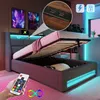 A bed with storage and LED lights is shown with a remote control in a hand. Produktbild-Vorschau