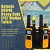Two walkie-talkies in the foreground with a construction site in the background. Náhled obrázku produktu
