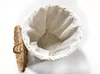 A top-down view of an open laundry basket with a white liner, next to its lid. Produktbild-Vorschau