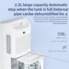 Close-up of a white dehumidifier with a water tank and an external water pipe. Text overlays describe its features. Produktbild-Vorschau