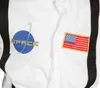 Close-up of a white astronaut costume with patches. Produktbild-Vorschau