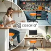 A collage of images showcasing an orange rolling stool in different home and workshop settings, with a woman in a kitchen and a workbench in a garage. Produktbild-Vorschau