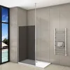 A modern bathroom with a walk-in shower, a towel rack, and a large window overlooking a tropical scene. Produktbild-Vorschau