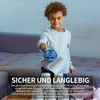 A young boy is playing with a flying ball toy indoors, with cups stacked in front of him. Produktbild-Vorschau