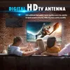 A family watching TV, with a digital antenna mounted on the wall. Podgląd zdjęcia produktu
