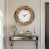 A decorative wall clock is displayed above a console table in a well-lit room. Podgląd zdjęcia produktu