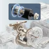 A close-up, cutaway view of a mechanical engine with gears and a motor, with a magnified inset showing the motor's internal components. Produktbild-Vorschau