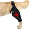 A dog's hind leg wearing a black knee brace with a diagram of bones and a red highlight indicating pain. Produktbild-Vorschau