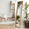 A tall, ornate mirror stands in a well-lit room with a dining table and chairs, a bookshelf, and plants. Náhľad obrázku produktu