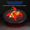 A close-up of a black grill grate with food on it, with red arrows indicating air circulation. Produktbild-Vorschau