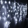 A wall decorated with white icicle string lights. Produktbild-Vorschau