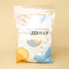 A clear plastic bag containing disposable food covers. Produktbild-Vorschau