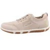 A side view of a beige sneaker. Náhled obrázku produktu