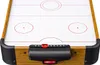 A close-up, top-down view of a miniature air hockey table. Anteprima dell’immagine prodotto