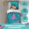 A young girl sleeping in a bed with butterfly-themed bedding. Produktbild-Vorschau