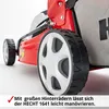 Close-up of the rear wheels and grass catcher of a red lawnmower. Produktbild-Vorschau
