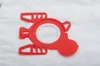 A close-up shot of a red vacuum cleaner bag adapter on a white textured surface. Produktbild-Vorschau