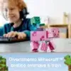 A child wearing headphones is playing on a computer with Minecraft toys in the foreground. Anteprima dell’immagine prodotto