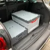 Two folding storage boxes are placed in the trunk of a car. Produktbild-Vorschau