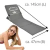 A woman is lying on a beach chair with a beach chair shown next to her with dimensions indicated. Produktbild-Vorschau