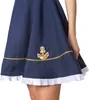 Close-up of the hem of a navy blue dress with gold trim and a white pleated ruffle. Produktbild-Vorschau
