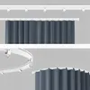 Two images showing a gray curtain hanging from a white track system. The top image shows a straight track, and the bottom image shows a curved track. Produktbild-Vorschau