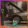 A tool kit is placed in front of a car with its hood open in a garage. Produktbild-Vorschau