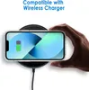 A hand is holding a clear phone case with an iPhone inside, which is placed on a wireless charger. Produktbild-Vorschau