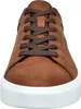 A close-up front view of a brown sneaker with white soles and brown laces. Produktbild-Vorschau