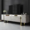 A modern TV stand with a marble-like finish and gold accents, displayed in a dimly lit, luxurious room. Voir les images du produit