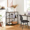 A home office setup with a bookshelf, desk, and chair. Produktbild-Vorschau