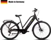 A black SAXONETTE E-Trekkingbike Premium Sport is shown against a white background. The bike has a rack on the back and disc brakes. Produktbild-Vorschau