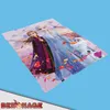 A blanket with characters from Frozen is displayed on a light blue background. Produktbild-Vorschau