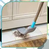 A mop is cleaning dust and debris from under a cabinet. Anteprima dell’immagine prodotto