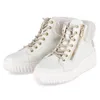 A pair of white high-top sneakers with beige laces and faux fur trim, shown against a white background. Produktbild-Vorschau