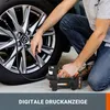 A person is using a portable air compressor to inflate a car tire. Produktbild-Vorschau