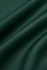 A close-up view of dark green satin fabric with folds and creases. Produktbild-Vorschau