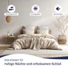 A neatly made bed with pillows and a duvet, set in a minimalist bedroom. Produktbild-Vorschau