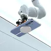A robotic arm holding a clear phone case with a phone inside, featuring a magnetic ring, against a white and light gray background. Anteprima dell’immagine prodotto