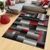 A modern living room with a sectional sofa, a rug, and a small red ottoman. Produktbild-Vorschau