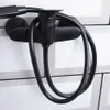 A black shower hose and faucet mounted on a tiled wall. Náhľad obrázku produktu