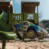 A remote-controlled truck is captured mid-air, jumping over a playground slide. Produktbild-Vorschau