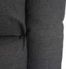 A close-up view of the textured fabric of a dark gray armchair or sofa cushion. Produktbild-Vorschau
