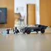 A LEGO Batman Batmobile with two minifigures on a wooden floor. Náhled obrázku produktu