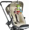 A baby mobile attached to a stroller. Voir les images du produit