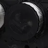 A close-up view of a black filter cap with white pleated filter material visible. Voir les images du produit