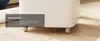 A close-up of a white appliance with wheels on a wooden floor, with a text overlay highlighting its mobility. Produktbild-Vorschau